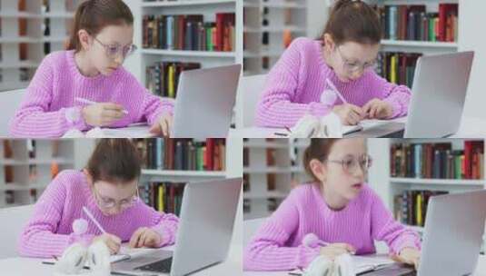 女孩使用笔记本电脑学习做笔记高清在线视频素材下载