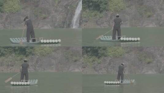 浙江温州泰顺县妇女在山水间划竹排高清在线视频素材下载