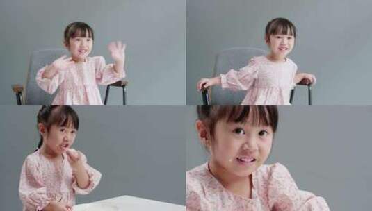 可爱漂亮爱笑的小女孩吃面包高清在线视频素材下载
