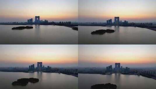 航拍苏州之门的落日与金鸡湖的风光高清在线视频素材下载
