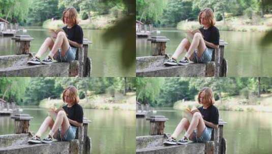 独自在湖边看书的女生高清在线视频素材下载