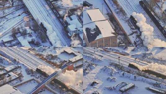 航拍中国东北冬季雪景中的蒸汽火车穿过村庄高清在线视频素材下载