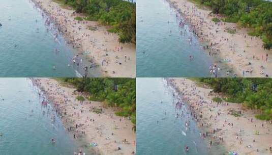 海南三亚三亚湾椰梦长廊海岸线上的游客高清在线视频素材下载