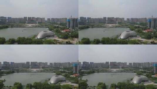 航拍河南漯河市市民之家月湾湖公园高清在线视频素材下载