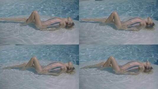 模特在泳池展现靓丽妩媚的身体高清在线视频素材下载
