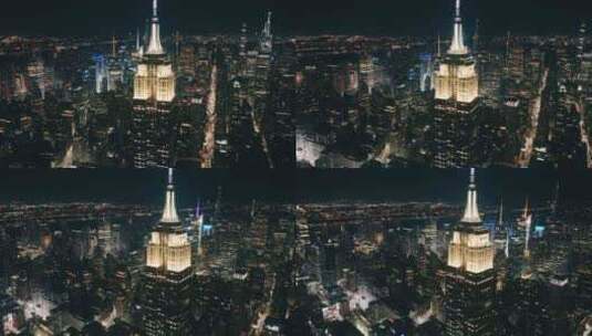 纽约市夜间突出帝国大厦屋顶周围的风景天线高清在线视频素材下载