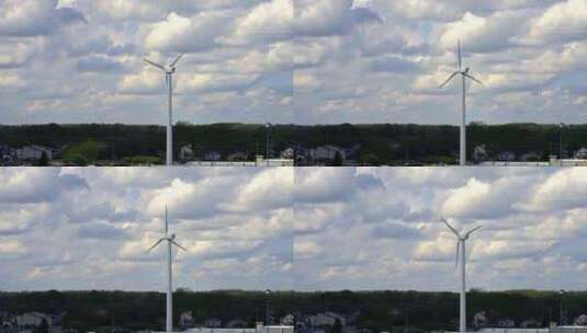 架空电力线旁的风车。高清在线视频素材下载