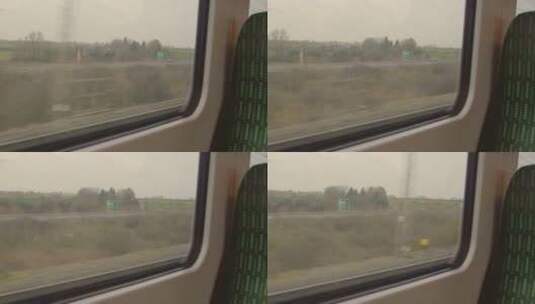 从行驶的火车车窗上看路边的风景高清在线视频素材下载