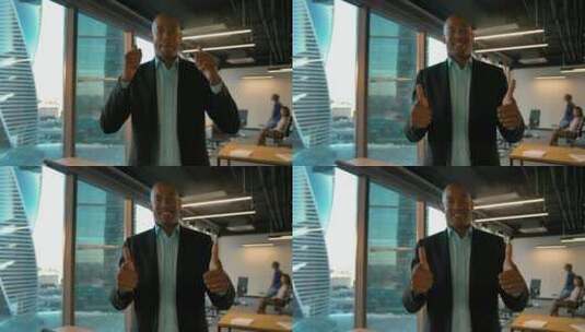 男商人在办公室竖起大拇指高清在线视频素材下载