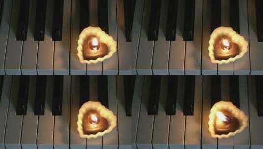 钢琴上的心形蜡烛高清在线视频素材下载
