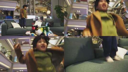小孩儿在商场沙发上开心的蹦跳高清在线视频素材下载