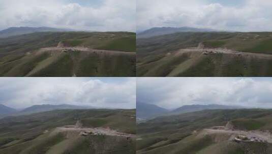 航拍新疆伊犁山丘公路大气风光高清在线视频素材下载
