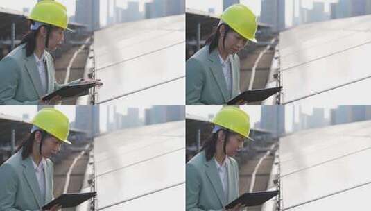 女性工程师在屋顶光伏太阳发电厂工作高清在线视频素材下载