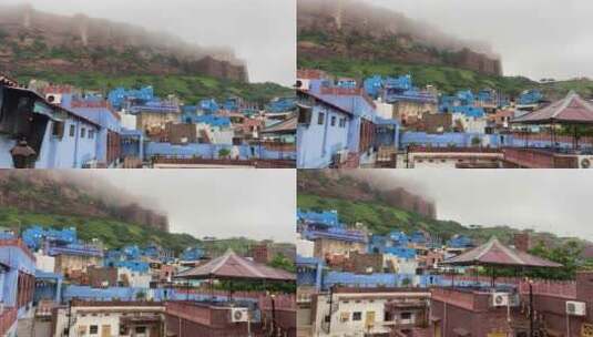 印度焦特布尔市标志性蓝房子后面被雾覆盖的梅赫兰格尔堡壁垒高清在线视频素材下载