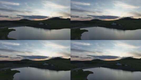 航拍绿色山谷湖泊暮色高清在线视频素材下载