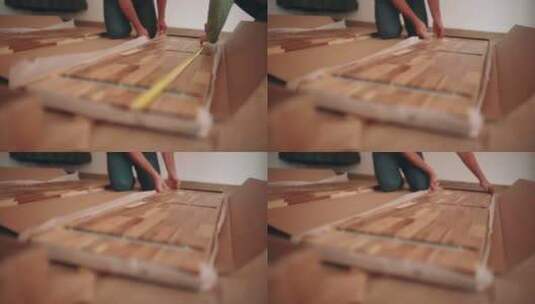 拆箱后测量一块木板用于DIY桌子组装。特写高清在线视频素材下载