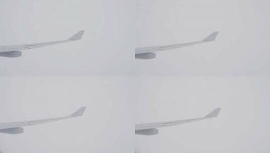 飞机上看窗外机翼云雾里穿梭飞行高清在线视频素材下载