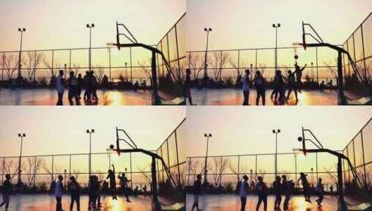 夕阳下球场打篮球升格镜头高清在线视频素材下载