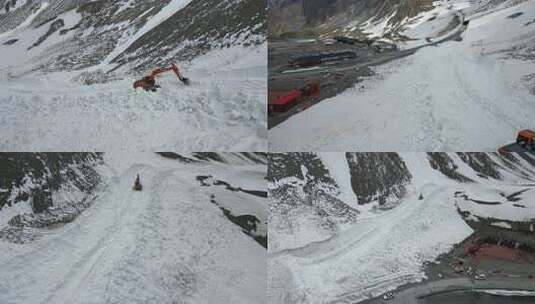 航拍独库公路冰达坂雪山机械清理积雪高清在线视频素材下载