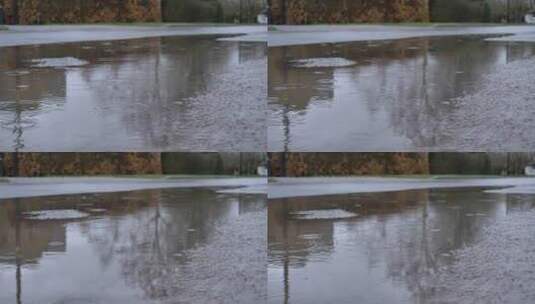 雨滴落水坑特写镜头高清在线视频素材下载