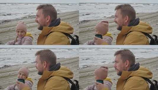 爸爸带着女儿在海边玩高清在线视频素材下载