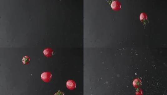 慢镜头拍摄新鲜爆浆小番茄落入水中创意视频高清在线视频素材下载