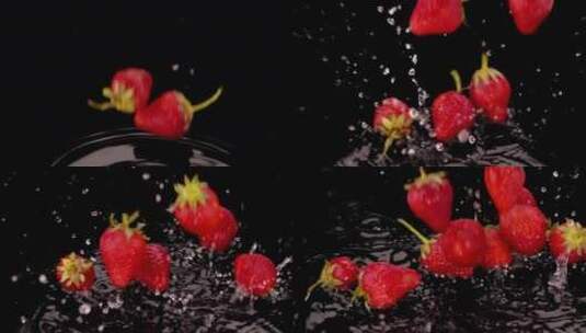 草莓掉进黑色的水里高清在线视频素材下载