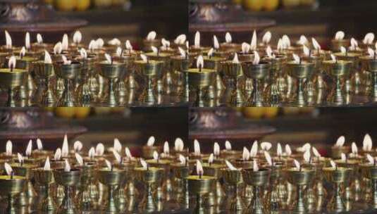 寺庙大殿内点燃的蜡烛和供品高清在线视频素材下载