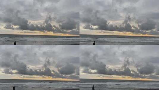 男子在印度尼西亚海滩看风景高清在线视频素材下载