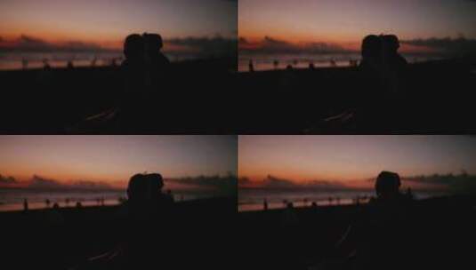 巴厘岛海边日落情侣火烧云高清在线视频素材下载