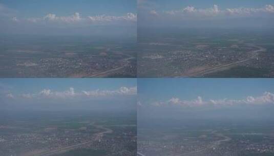 飞机窗外云层下的城市高清在线视频素材下载