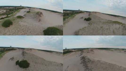 无人机放大了令人惊叹的贫瘠沙漠景观和一个女孩在高处奔跑的后续镜头高清在线视频素材下载