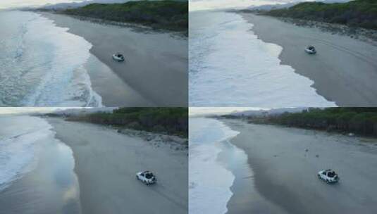 航拍海滩上的越野车高清在线视频素材下载