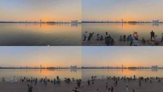 一群游客在南京玄武湖情侣园欣赏日落高清在线视频素材下载
