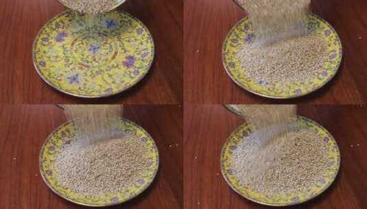 白藜麦倒在盘子里 食材展示 五谷杂粮高清在线视频素材下载