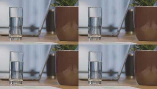 水杯和植物的低角度拍摄高清在线视频素材下载