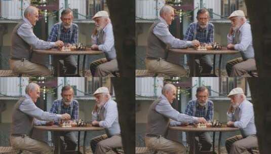 退休老人围着桌子下国际象棋高清在线视频素材下载