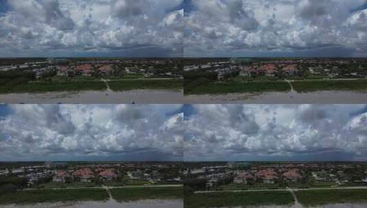佛罗里达州沿海海滩的无人机镜头，有粉红色屋顶的豪华别墅。高清在线视频素材下载