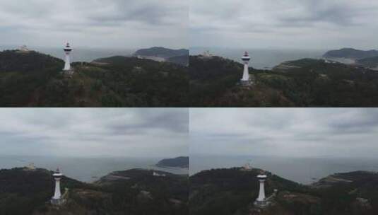 航拍阴天悬崖边上的灯塔大海风光高清在线视频素材下载