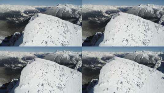 滑雪者在积雪覆盖的山上滑雪4k高清在线视频素材下载