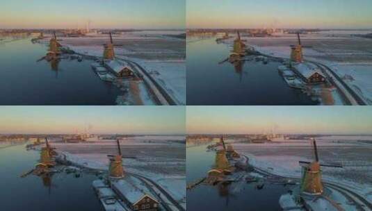 Zaanse Schans风车村的木制风力磨坊在冬季与雪景雪高清在线视频素材下载