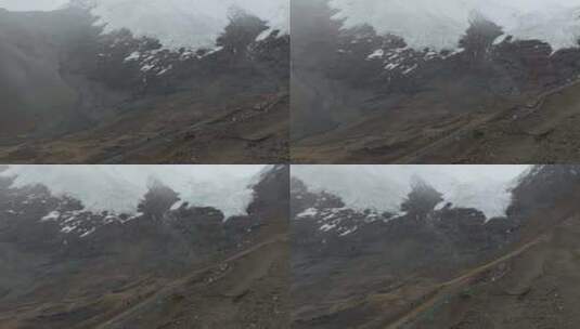 航拍风雪中的西藏山南卡若拉冰川高清在线视频素材下载