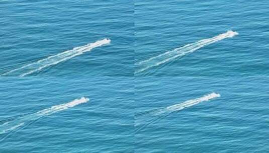 航拍三亚海棠湾蓝色大海上摩托艇飞驰高清在线视频素材下载