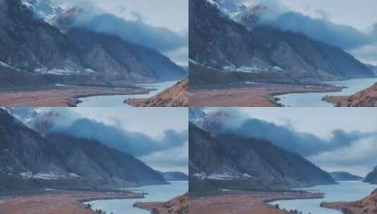新疆昭苏玉湖冰面雪山峡谷航拍风景高清在线视频素材下载