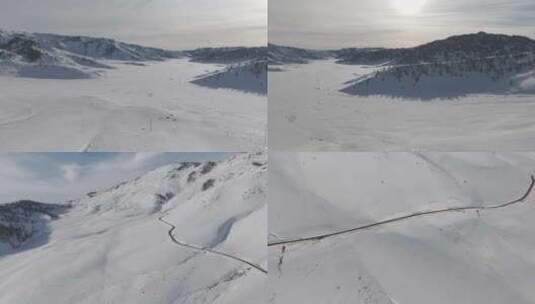 新疆冬日无人机大气航拍白色山谷公路高清在线视频素材下载