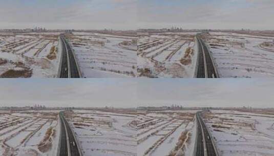 中国黑龙江哈尔滨阳明滩大桥雪景航拍高清在线视频素材下载