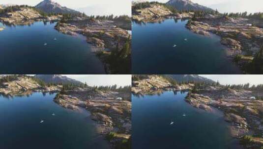 平静湖面上的山顶划桨高清在线视频素材下载