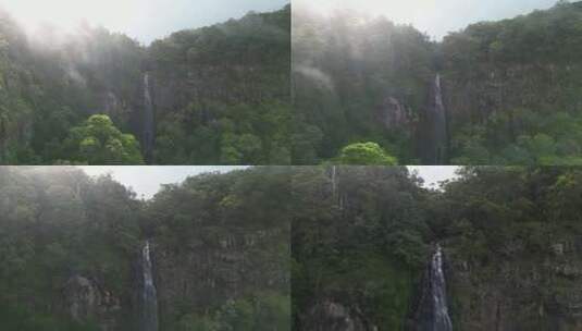 穿过阳光湿透的迷雾，露出隐藏的热带雨林瀑高清在线视频素材下载