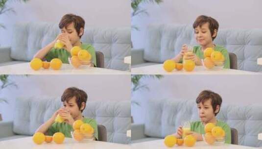 专注于新鲜柑橘味的孩子享受一杯橙汁维生素高清在线视频素材下载