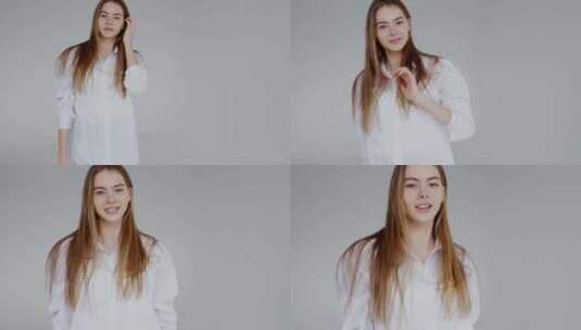 自信的年轻女子穿着白色衬衫微笑着摆姿势高清在线视频素材下载